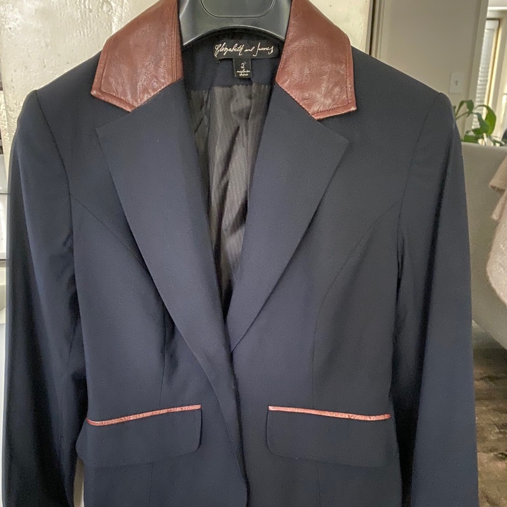 Elizabeth and James navy blazer with brown leather details.